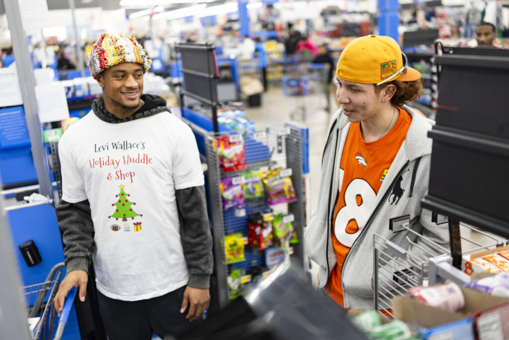 Pat Surtain II during a holiday shopping event with the Levi Wallace Foundation at  in Aurora, Colorado on December 9, 2024. Photo by Ben Swanson / Denver Broncos