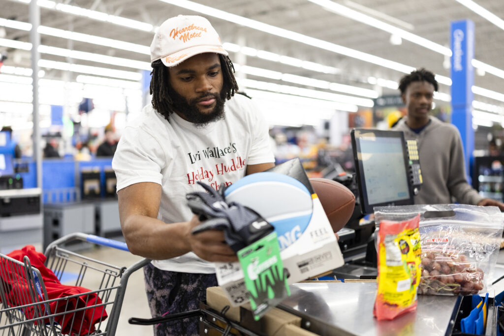 Jaleel McLaughlin during a holiday shopping event with the Levi Wallace Foundation at  in Aurora, Colorado on December 9, 2024. Photo by Ben Swanson / Denver Broncos
